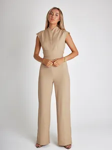 Chic sleeveless wide-leg jumpsuit in beige with a cinched waist for a slim silhouette.