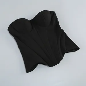 Close-up detail of a black structured fishbone corset top with elegant seam lines and padding