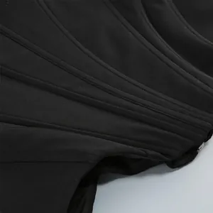 Close-up detail of structured vertical boning on a black corset style mesh tube top