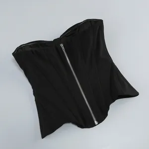 Detail shot of a black fishbone corset top with front zipper closure and structural seams.
