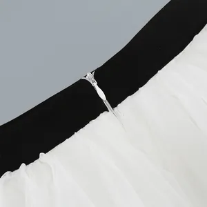 Close-up detail showing the concealed zipper on a black and white mesh tutu skirt