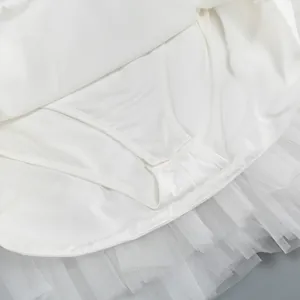 Close-up detail of the white mesh tulle tutu skirt with built-in safety lining shorts