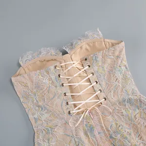 Detailed view of the corset-style lace back on a long fishtail dress