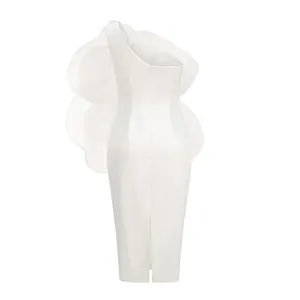 Back view of white one-shoulder midi dress featuring a large decorative organza ruffle