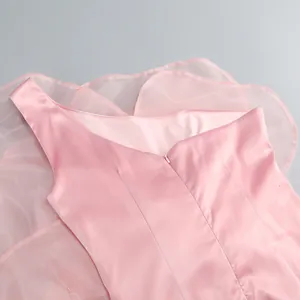 Detailed view of a pink one-shoulder satin party dress with mesh floral accents