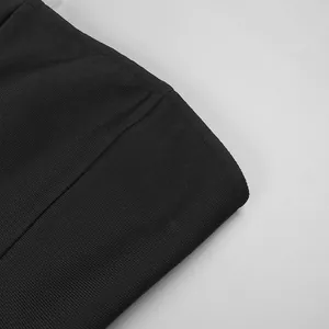 Close-up detail of the premium black ribbed fabric texture on this strapless evening dress