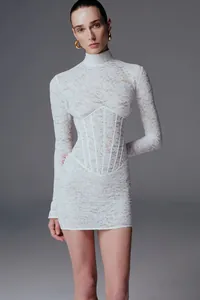 Detailed shot of white lace jacquard mini dress with high collar and corset waist detail.
