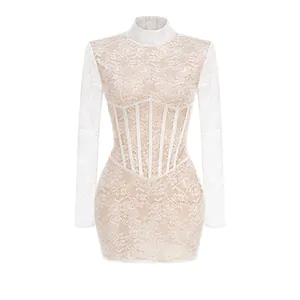 Close-up of elegant white floral lace mini dress with high collar and corset waist detail.