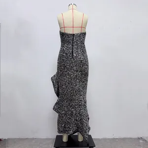 Detailed back view of a shimmering sequined strapless evening dress on a mannequin.