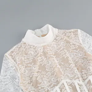 Detailed view of white floral lace mock neck dress with elegant back zipper closure