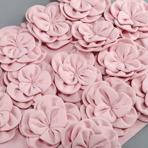Detailed view of pink 3D fabric flowers on the elegant women's high-end skirt set