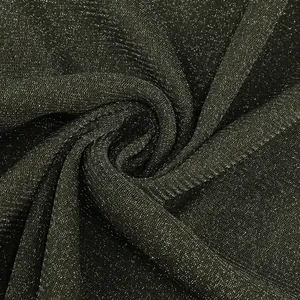 Close-up of sparkling black shimmer fabric with pleated texture for an elegant evening dress