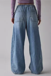 Close-up back view of women's baggy wide-leg loose denim jeans with elastic waist
