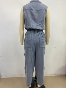 Back view of a women's casual washed thin denim sleeveless jumpsuit with elastic waist.
