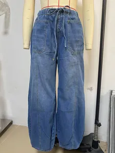 Front view of women's casual blue denim jeans with elastic drawstring waist on mannequin