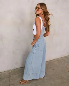 Fashionable light wash denim overalls featuring wide leg design and pocket detail