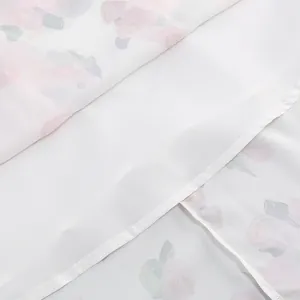 Detailed macro shot showing the clean white inner lining and floral print fabric of the dress