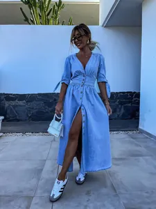 Stylish light blue V-neck maxi denim dress featuring button-down front and tie-sleeves