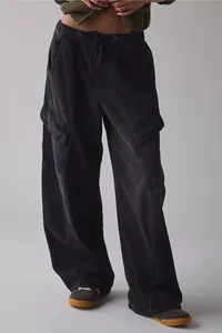 Detail of women's loose cargo jeans in washed black street style