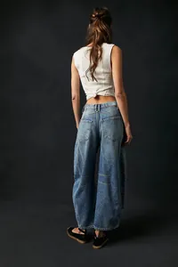 Back view of women's barrel leg denim jeans showing pocket detail and relaxed fit