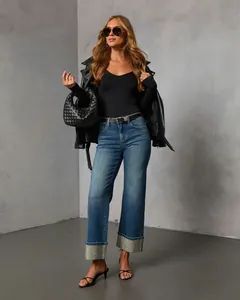 Stylish washed blue straight-leg jeans for women featuring sparkling rhinestone hems