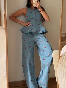 Vintage light blue denim set with cherry embroidery, sleeveless peplum top and wide-leg pants