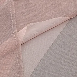 Macro detail view of dusty rose sheer mesh fabric for slim fit long dress.