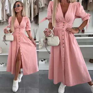 Detailed view of a pink V-neck button-down denim midi dress with tied sleeves