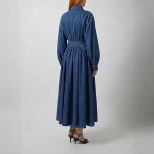 Back view of long sleeve denim dress with lantern sleeves and gathered waistline
