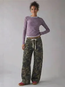 Full-length view of stylish women's loose camouflage cargo pants featuring drawstring waist