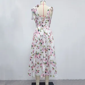 Detailed rear view of floral print midi dress with lace-up back and tie straps