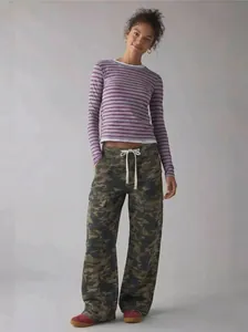 Full-length view of women's loose camouflage cargo pants with drawstring waist