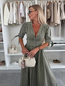 Elegant olive green denim maxi dress with a deep V-neck and stylish button-down front