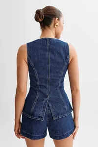 Back view of a stylish dark blue denim sleeveless vest and high waist shorts set