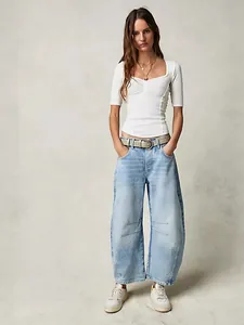 Casual women's light blue mid-waist barrel leg jeans with a relaxed loose fit
