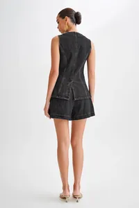 Back view of a stylish black sleeveless denim set with high-waist shorts for women