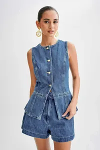 Professional studio shot of a two-piece denim set with sleeveless vest and high-waisted shorts.