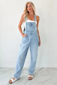 Fashionable light blue denim overalls for women with adjustable straps and pockets