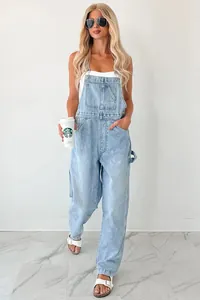 Full length view of light wash denim cargo overalls featuring a functional multi-pocket design