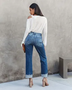 Back view of women's washed straight-leg denim jeans with distressed cuffed hems