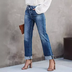 Casual blue washed straight-leg jeans for women with unique crossover waist design.