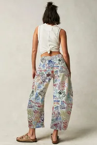 Back view of women's loose barrel-leg jeans with vibrant graffiti cartoon prints
