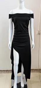 Detail view of black off-the-shoulder evening dress with pleated waist and high slit