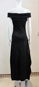 Back view of elegant black off-the-shoulder evening dress with slit details
