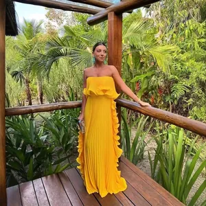 Elegant yellow pleated strapless maxi dress for summer resort style
