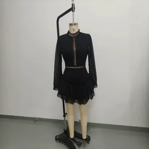 Black chiffon dress with hollow-out details and stand collar on mannequin