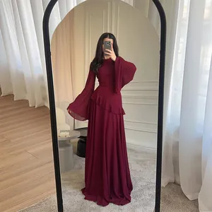Elegant burgundy long sleeve maxi dress with flared sleeves and feminine ruffle detail