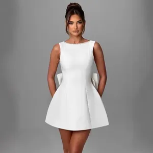 Elegant white sleeveless A-line mini dress with pearl neckline and back bow detail