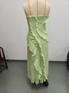 Back view detail of light green pleated halter maxi dress with asymmetric ruffles