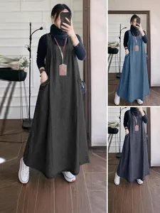 Vintage loose long denim pinafore dress with large pockets available in black blue and grey